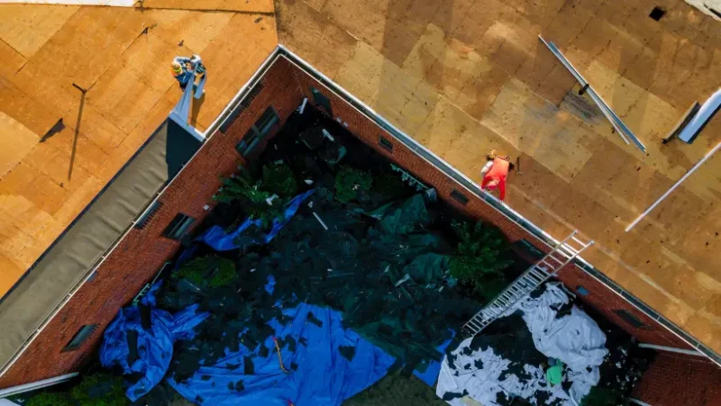 Aerial view of a roof featuring a man standing on it