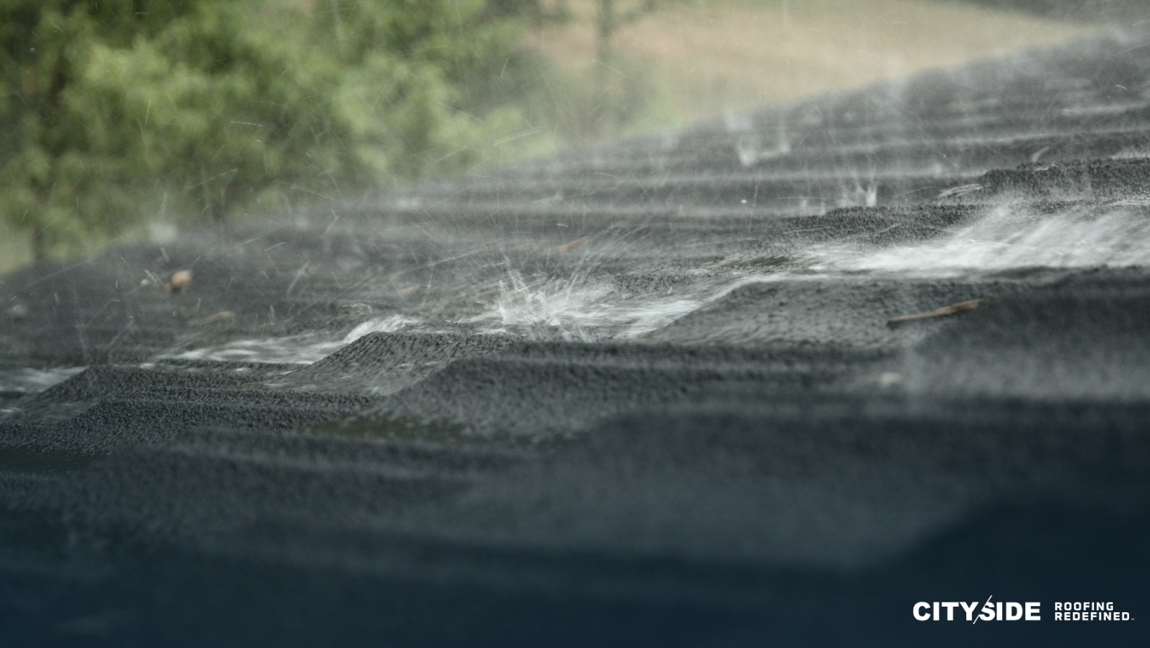 A close-up view of a roof with rain cascading down, creating a serene and tranquil atmosphere.