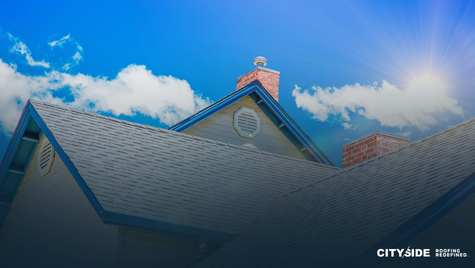 Bright sunny day showcasing a well-maintained residential roof with shingles and a brick chimney.