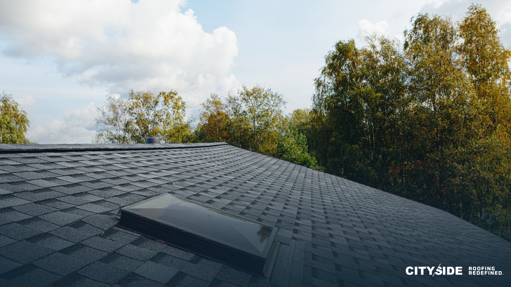 A roof featuring a skylight, allowing natural light to illuminate the interior space below.