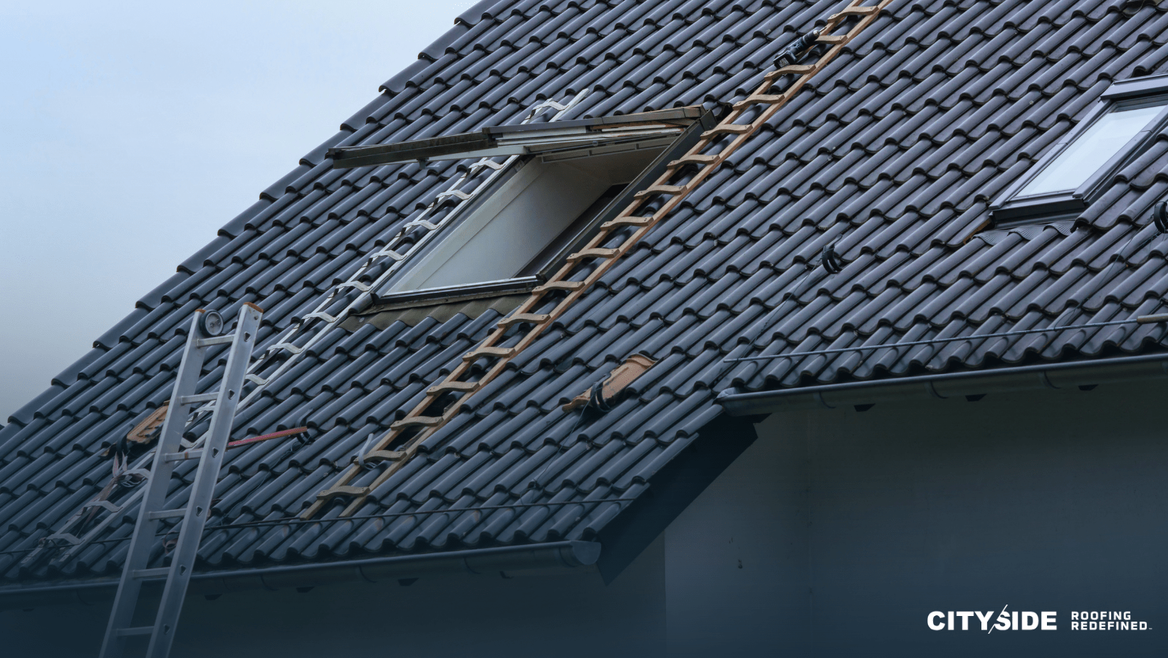 A ladder is placed on the roof of a house, indicating maintenance or construction work in progress.