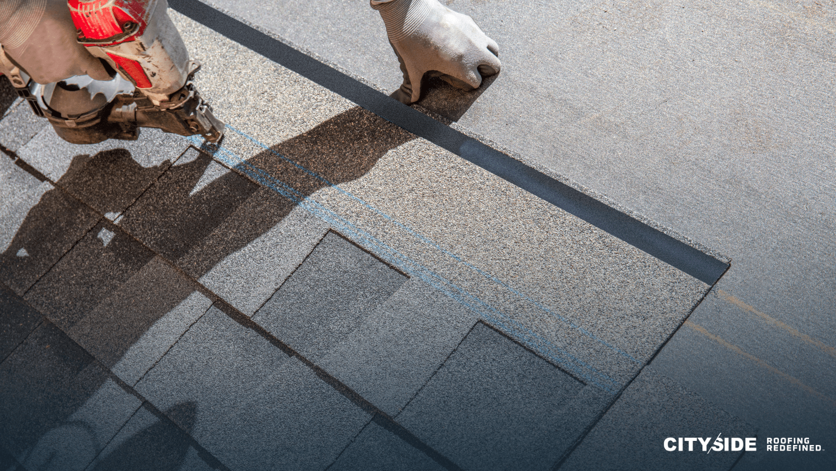  A person operates a nailer to securely install a roofing shingle on a house, demonstrating skilled craftsmanship.