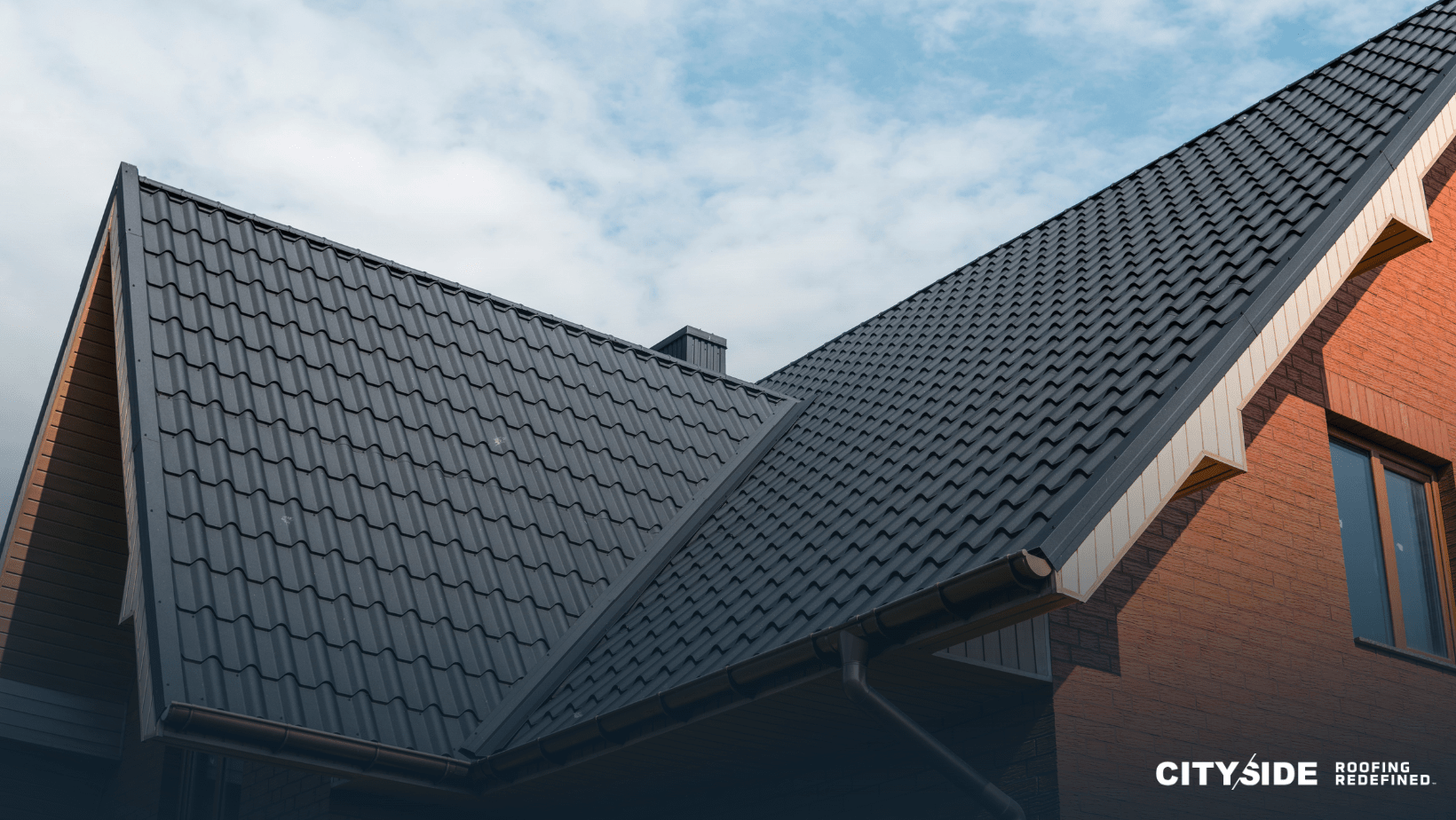 A house roof featuring the word "cetegro" clearly visible, set against a bright blue sky.