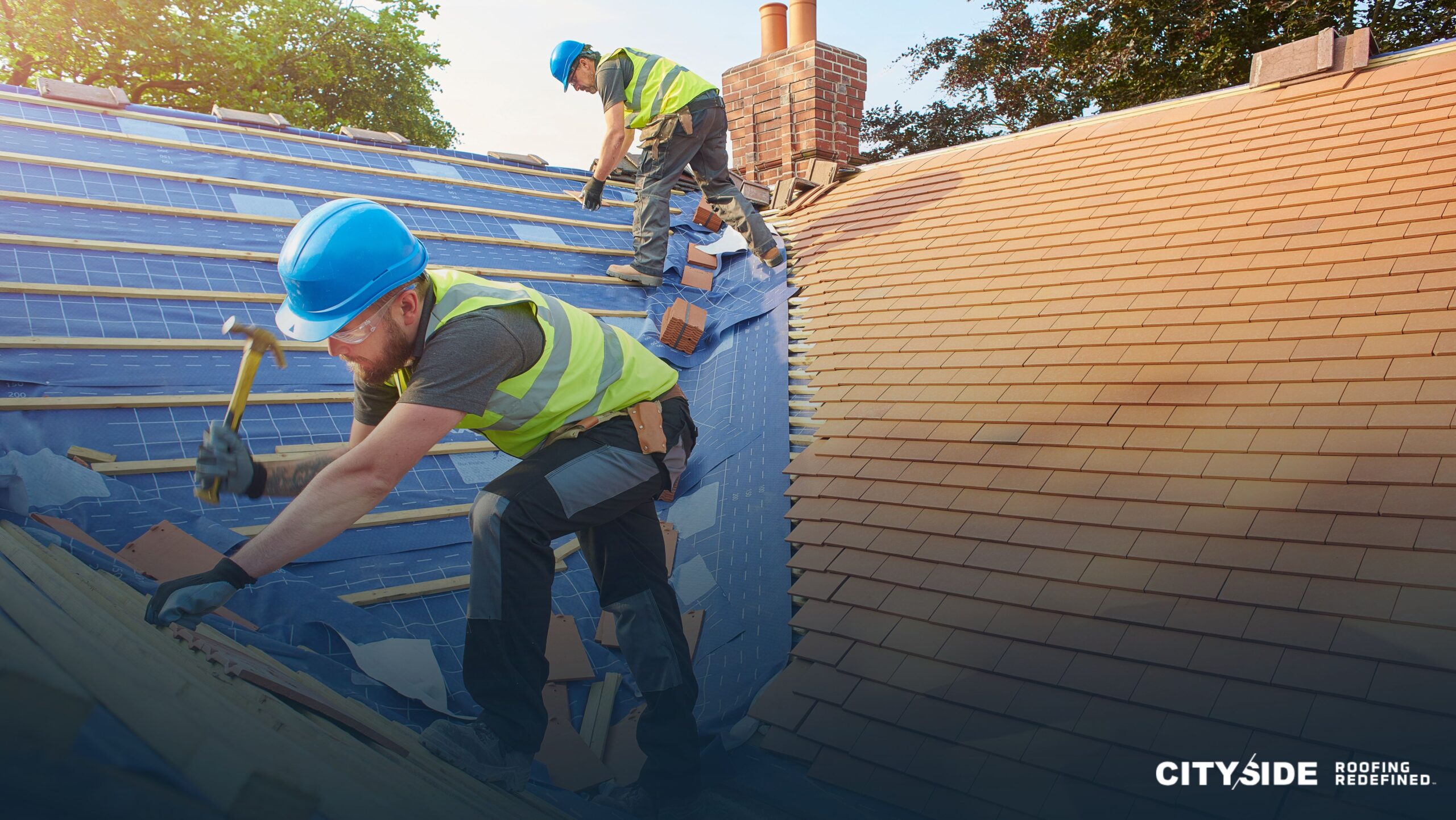 Two men installing roofing materials on a house, with the words "Cityside Roofing" prominently displayed nearby.