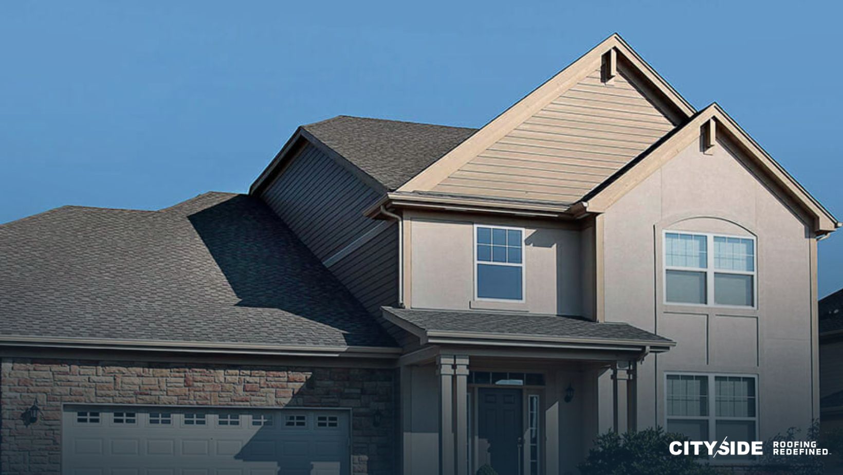 house showcasing a large garage
