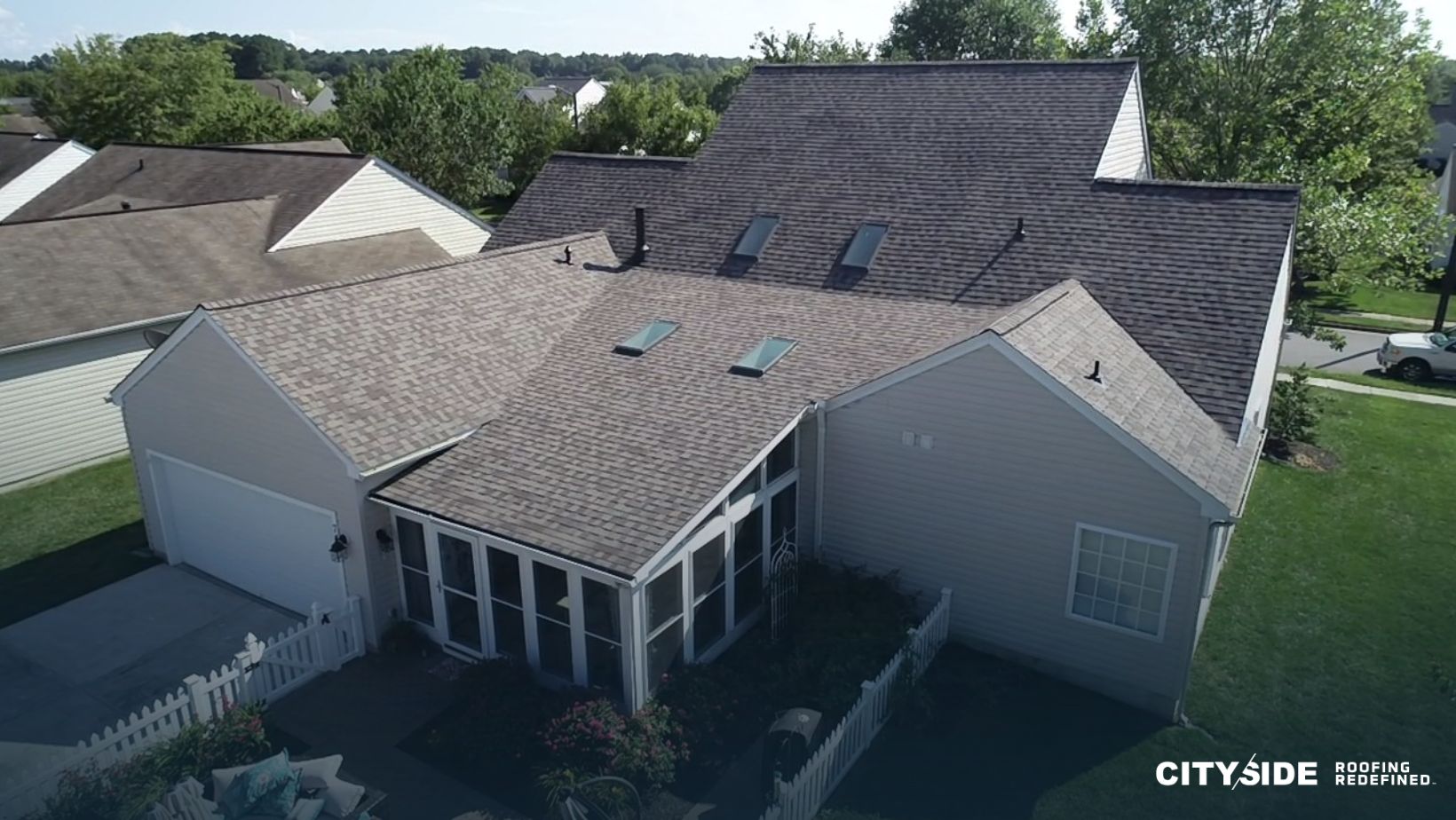 A house featuring a traditional shingle roof