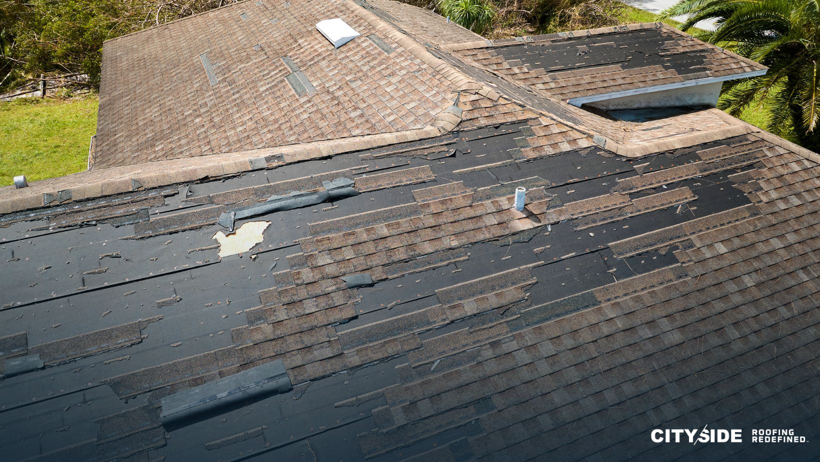 A roof featuring a broken shingle