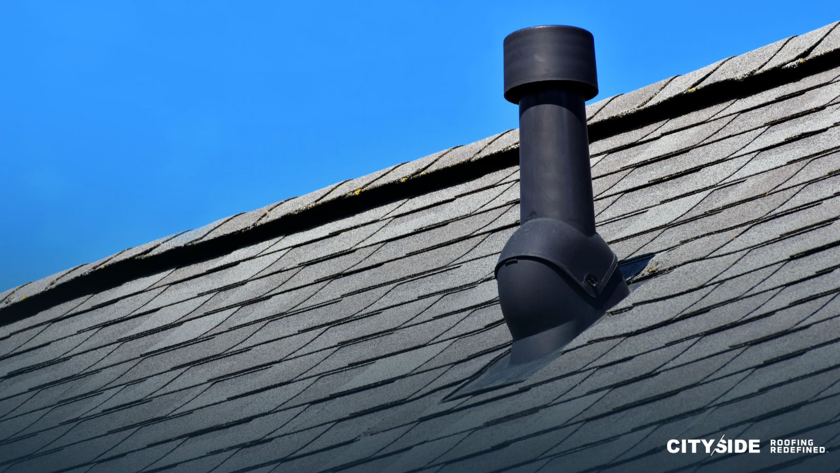 A chimney rises from the roof of a house