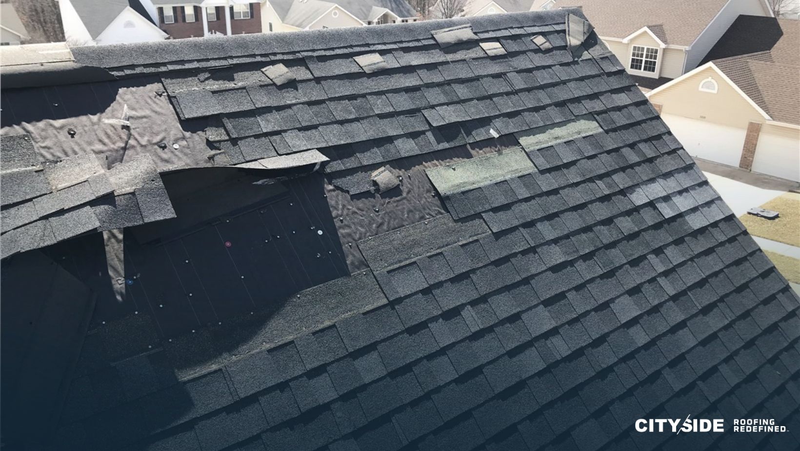 A roof displaying a damaged shingle alongside a broken shingle