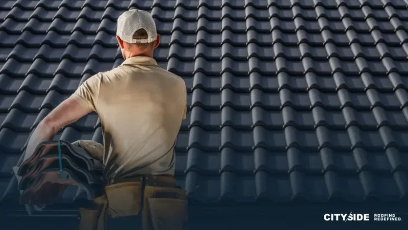 A man stands on a rooftop, holding a tool, surveying the area around him with a focused expression