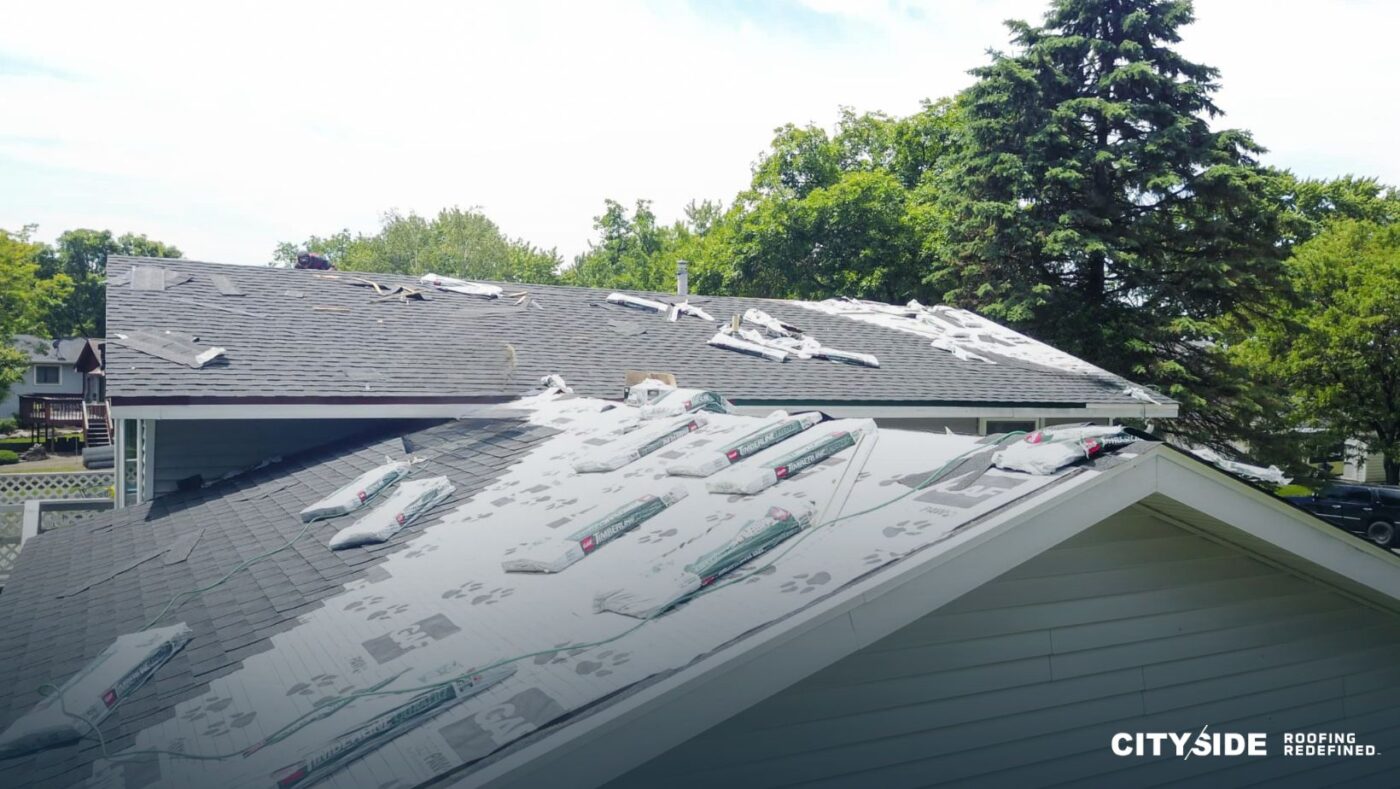 A roof covered with a dense layer of shingles