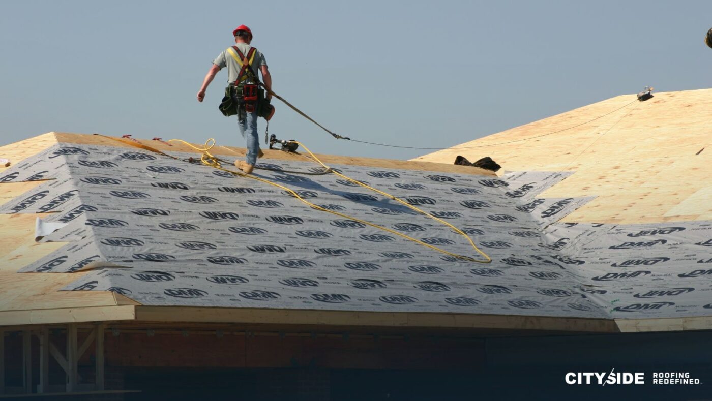 A man stands on a roof