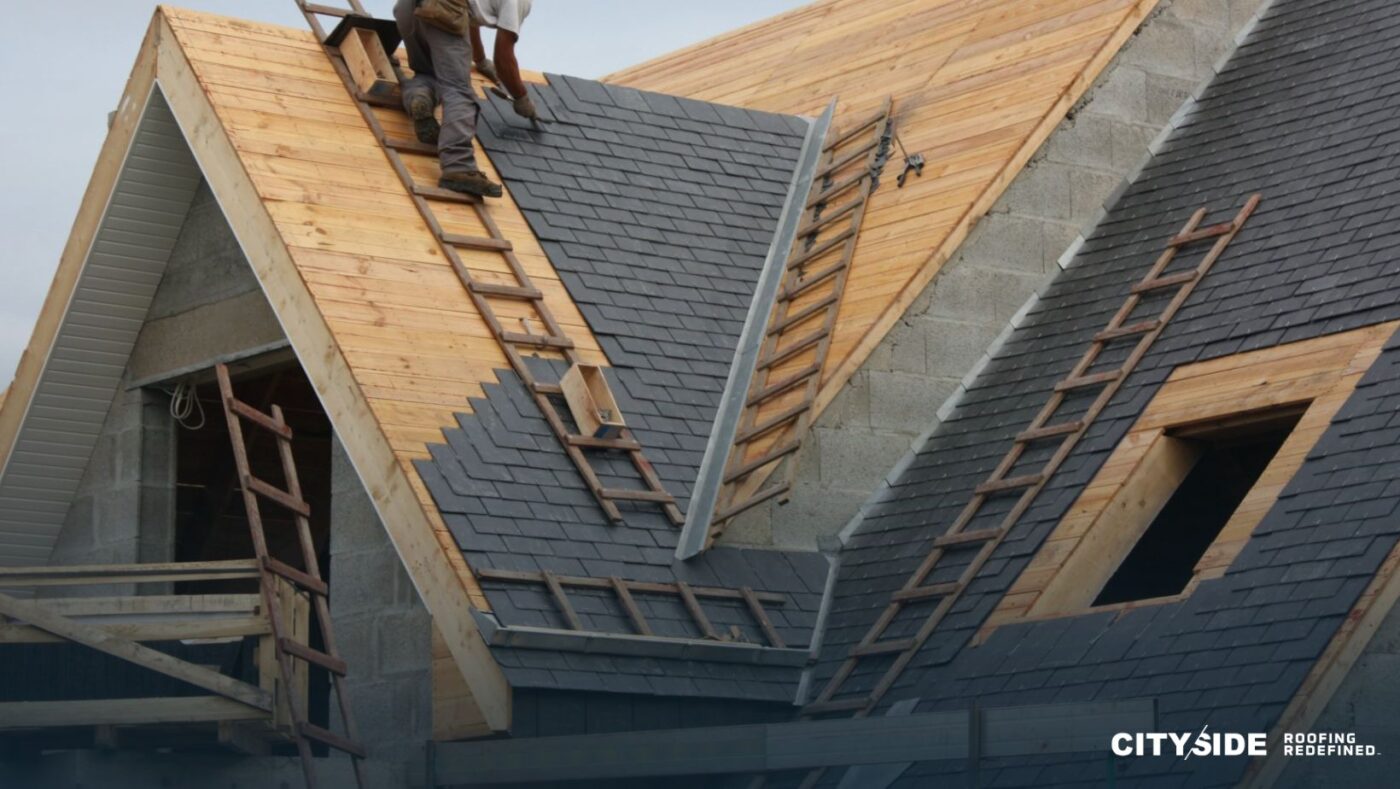 A roofing contractor working diligently on a residential roof