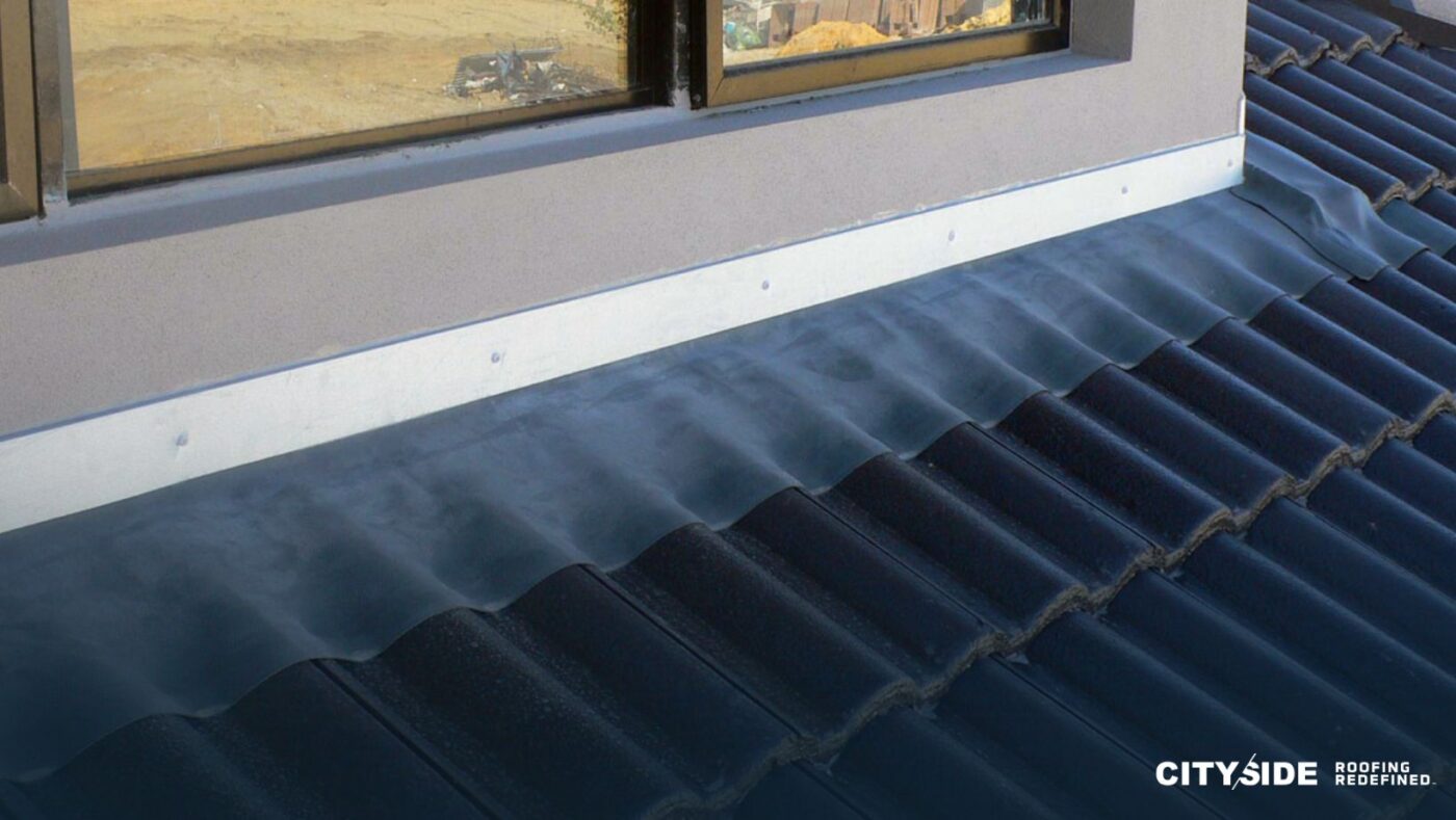 A metal roof featuring a window