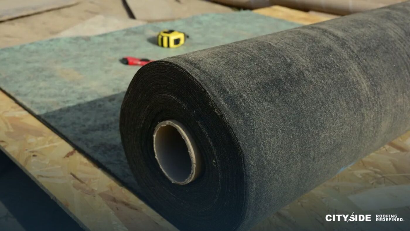 A black felt roll placed on a wooden roof