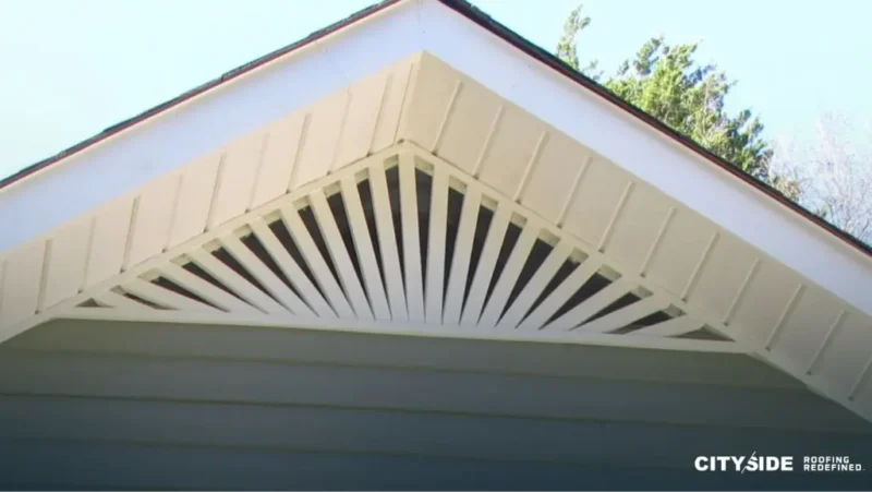 house roof featuring a window and white siding