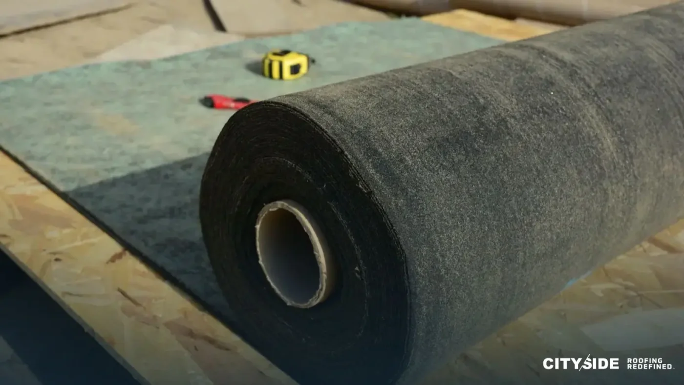 A black felt roll placed on a wooden roof