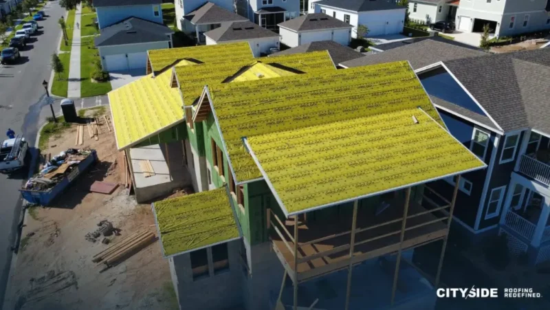 A house featuring bright yellow roofing material