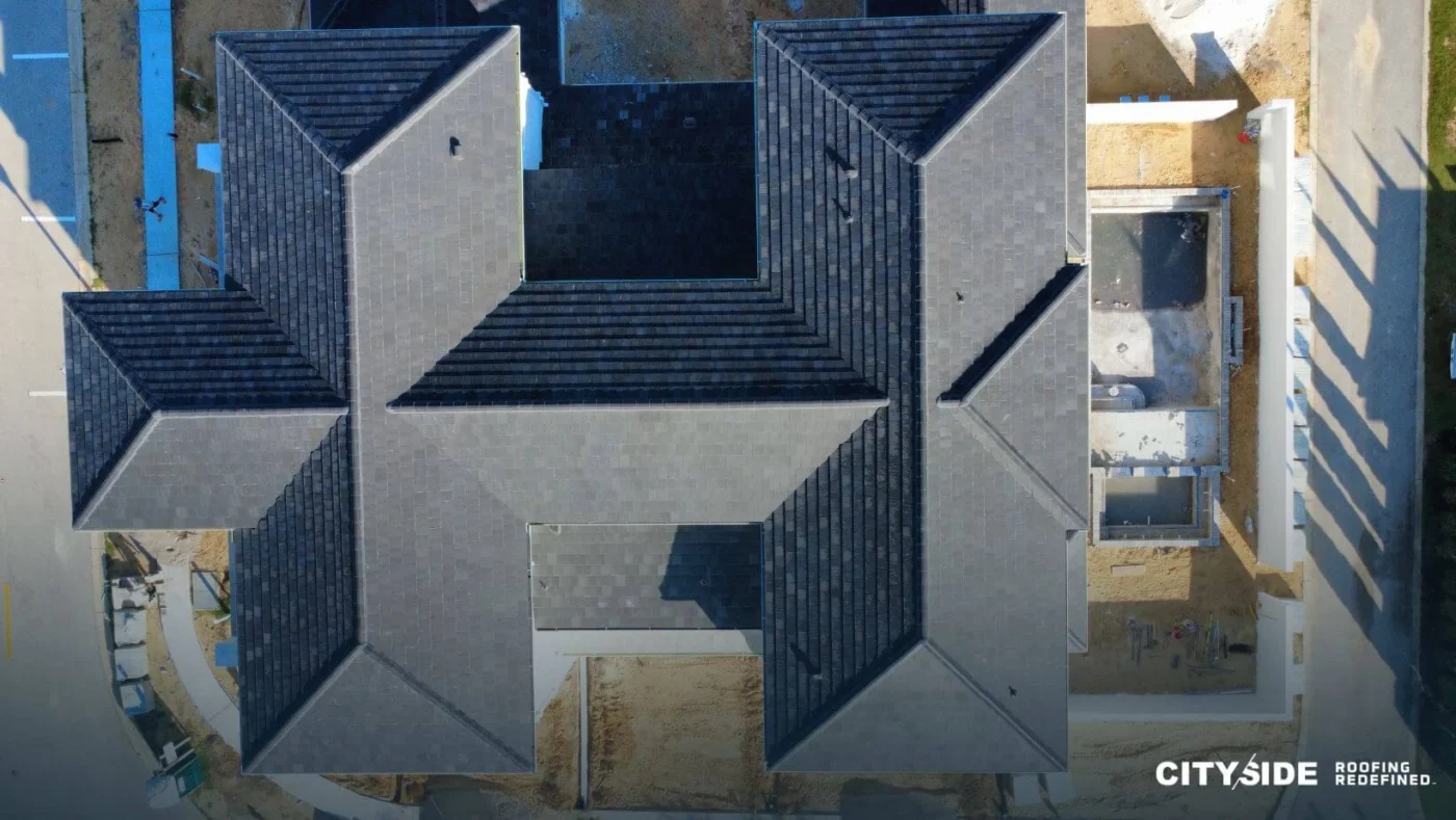 A house featuring a prominent large roof, showcasing its distinctive architectural style and design.