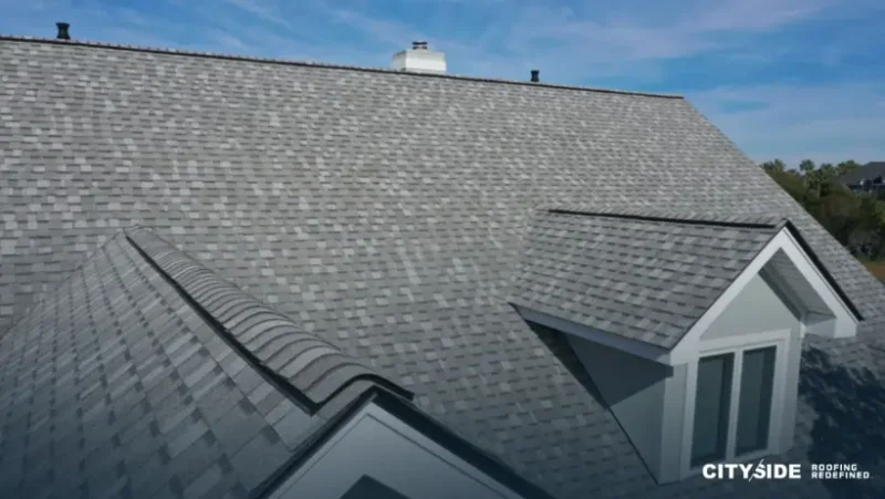 A house roof featuring gray shingles, showcasing a classic and durable roofing style.