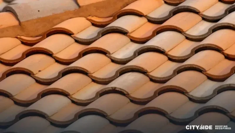 Close-up view of a roof showcasing a detailed tile pattern in earthy tones