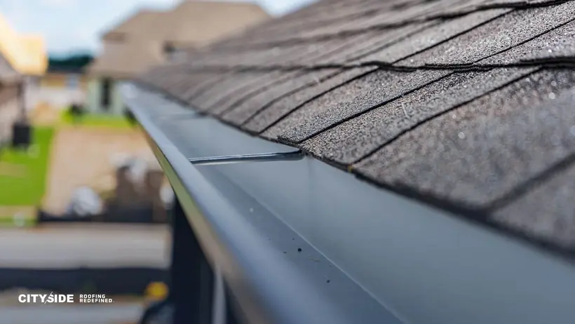 Detailed image of a gutter on a roof, highlighting its design and function in water drainage.