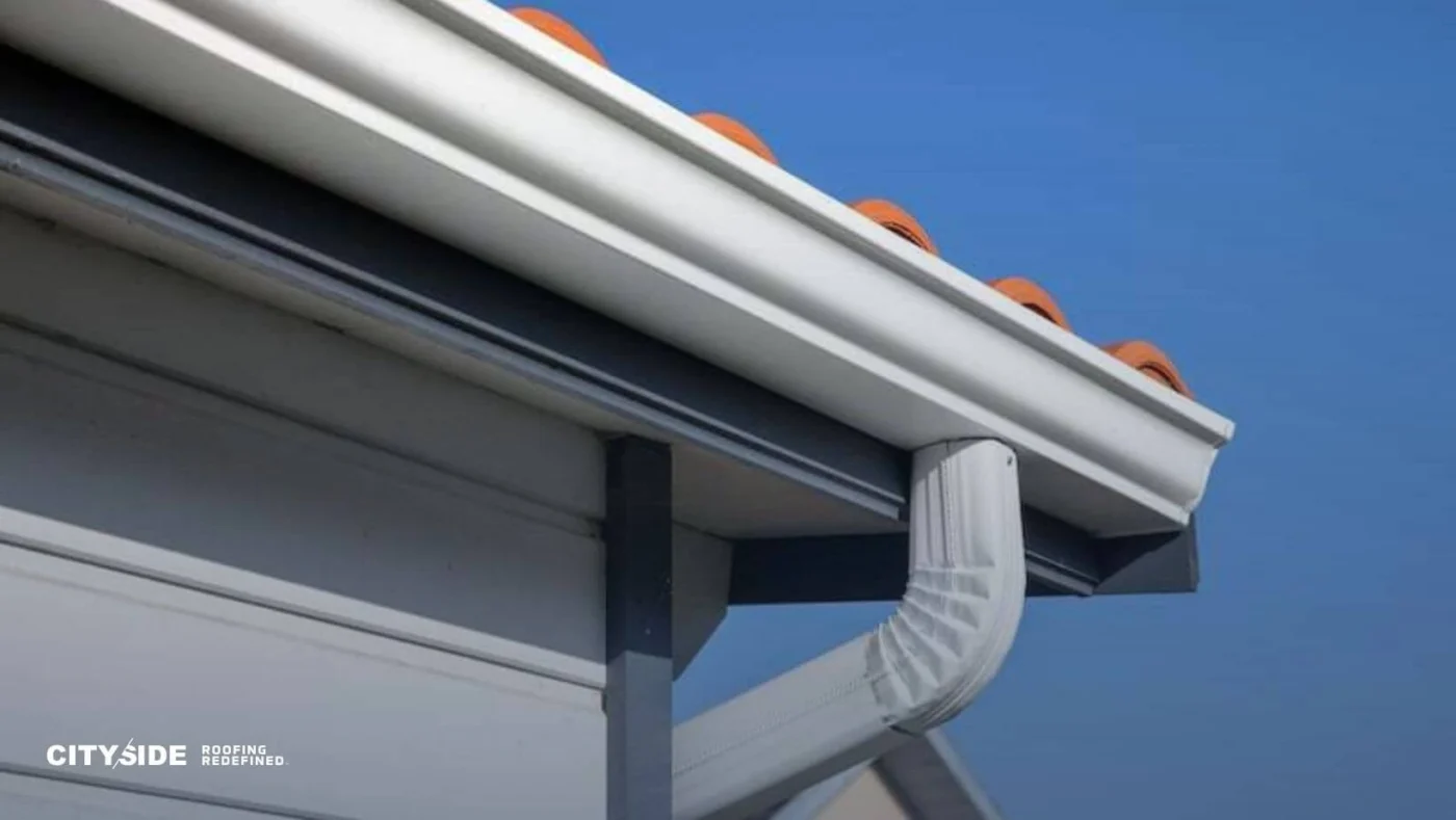 Close-up view of a house gutter, showing its structure and potential debris accumulation.