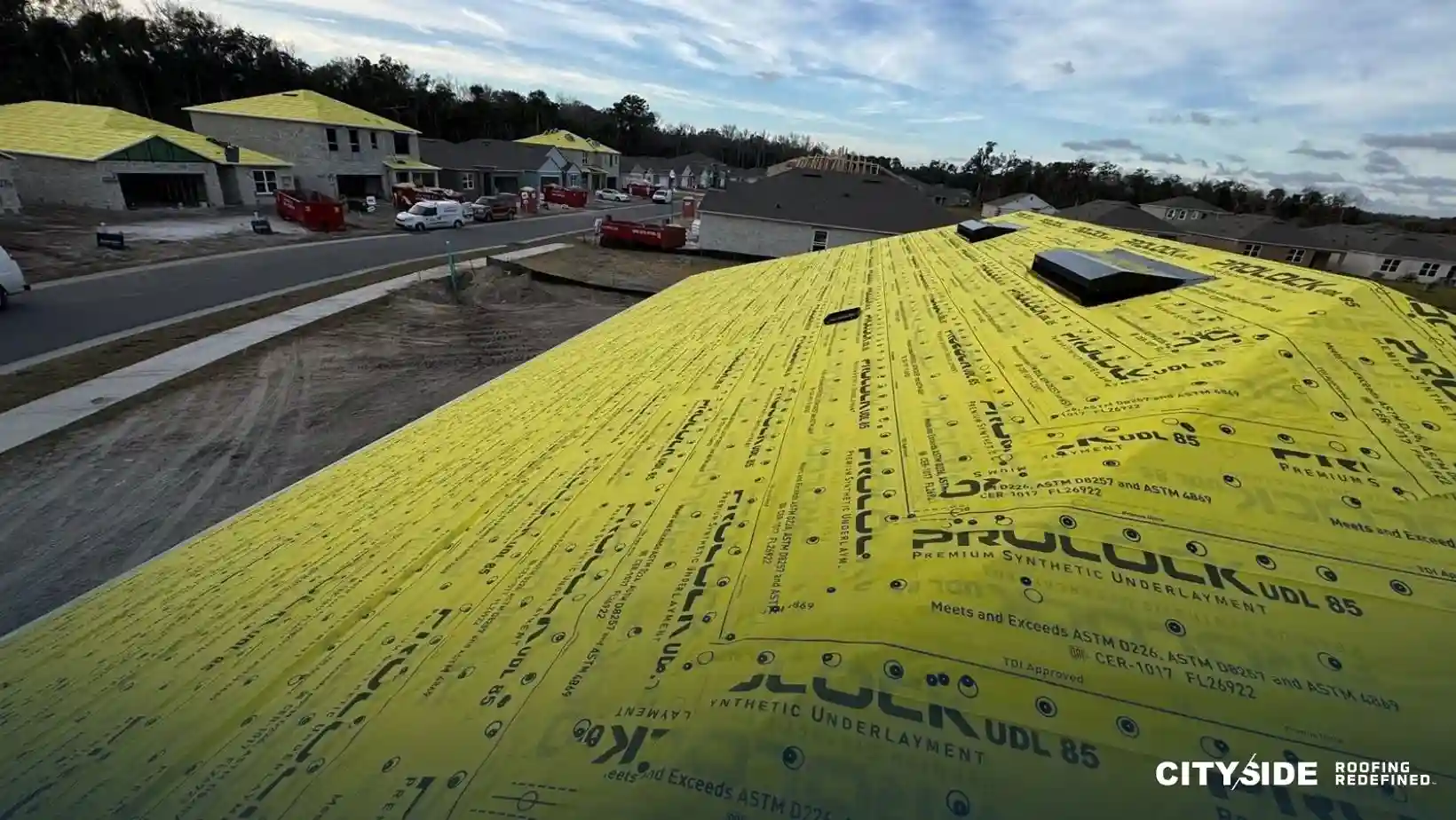 A yellow roof covered with a yellow tarp