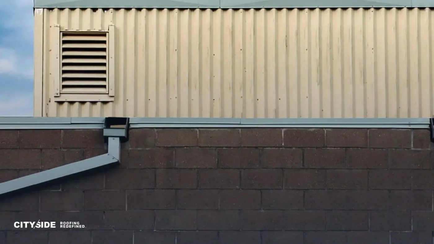 A simple structure with a window and a peaked roof, set in an outdoor environment.